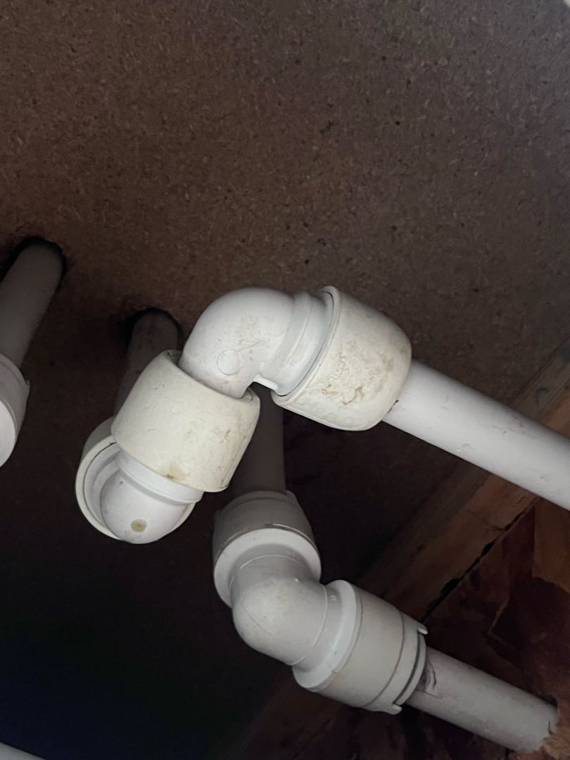 Replacement elbow fittings in the ceiling void of the Walsall property.